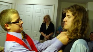 Isaac straightening Nathan's Bolo.