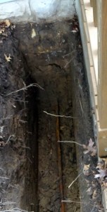 The trench with the old water line still in it.