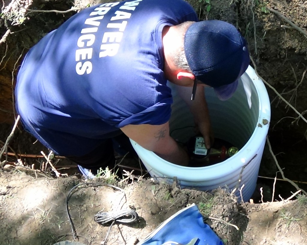 Inspector installing meter.