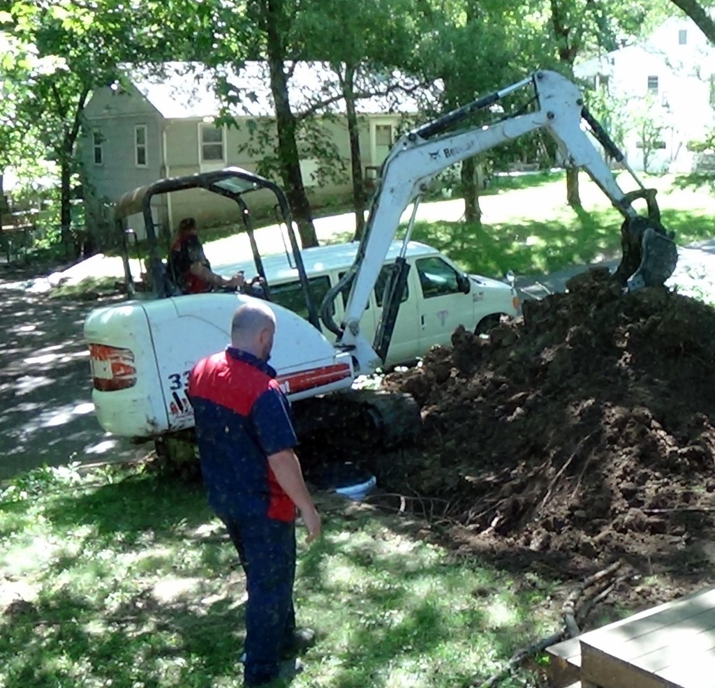 Packing the dirt back in.