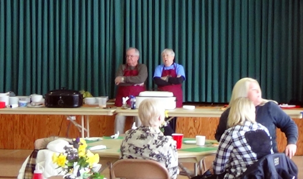 Waiting for diners at the soup and corn bread table.